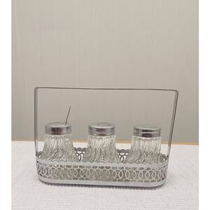 Vintage Crystal like l salt and pepper in silver plated caddy